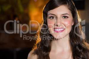 Smiling young woman in bar