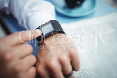 Man adjusting time on smartwatch