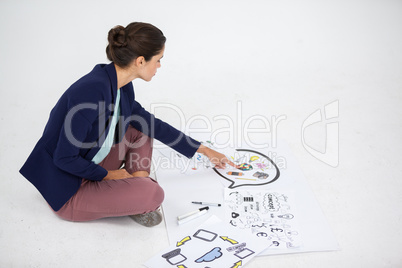 Businesswoman working on icon charts