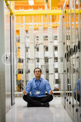 Technician meditating in hallway