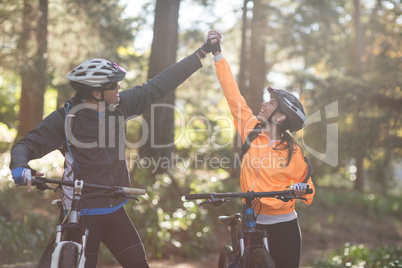 Biker couple holding each others hands