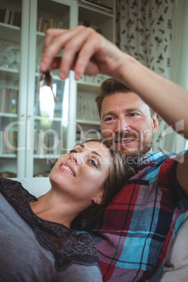 Happy couple holding their house key