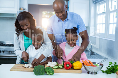 Happy family preparing food Happy family preparing food