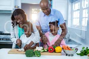 Happy family preparing food