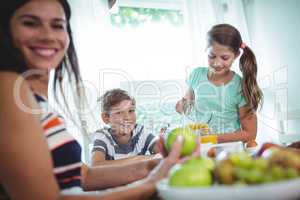 Smiling family having a breakfast