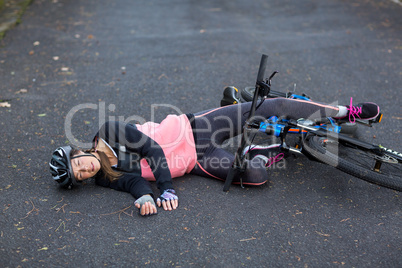 Female biker fallen from her mountain bike