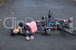 Female biker fallen from her mountain bike