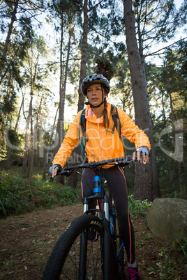 Female biker cycling in countryside