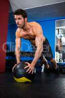 Determined athlete exercising in gym