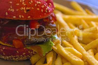 Beef burger and fries plate.