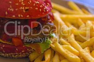 Beef burger and fries plate.