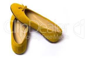yellow female shoes on a white background