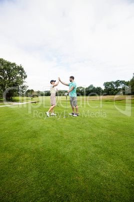 Couple giving high five to each other