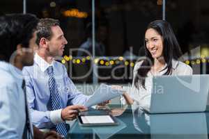 Businesswoman discussing with colleagues