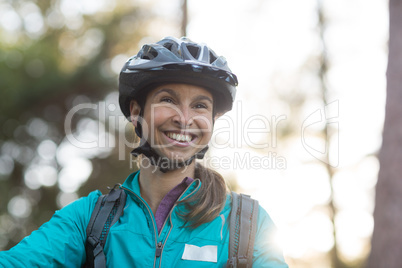 Beautiful female biker smiling