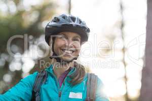 Beautiful female biker smiling