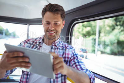 Handsome man using digital tablet