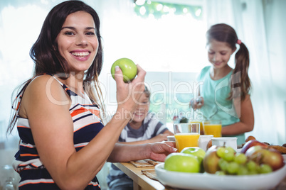 Smiling family having a breakfast