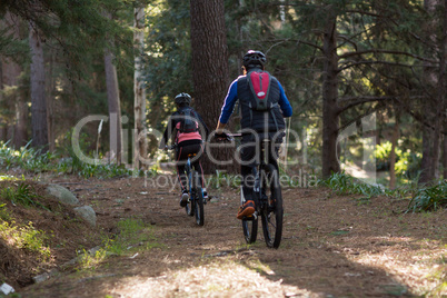 Biker couple cycling in countryside