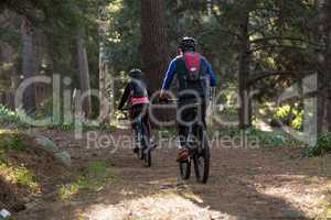 Biker couple cycling in countryside