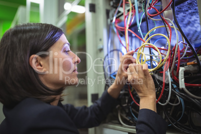 Technician fixing cable
