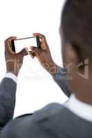 Close-up of businessman using mobile phone