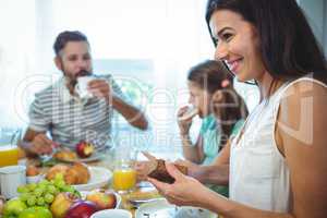 Woman smiling while have breakfast