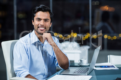 Portrait of businessman at his desk