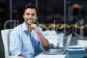 Portrait of businessman at his desk