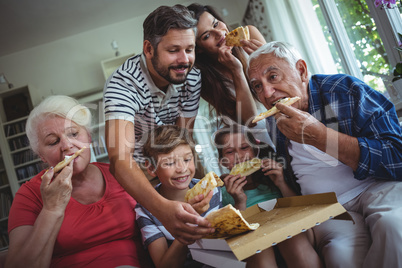 Multi-generation family having pizza together