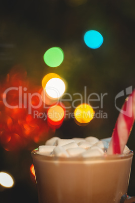 Cup of coffee with marshmallow and candy cane