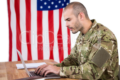 Solider using a laptop at desk