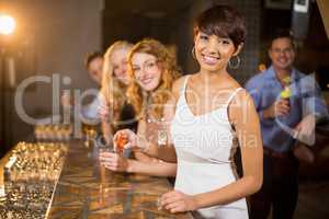 Group of friends having tequila in bar