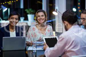 Smiling businesspeople working in office