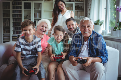 Family watching the kids playing video game