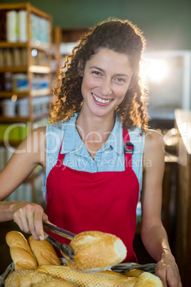 Portrait of smiling female staff working at bakery store