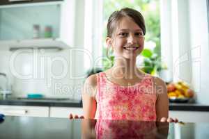 Portrait of smiling girl in kitchen