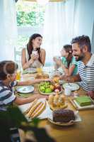 Happy family having breakfast together