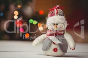 Close-up of snowman on wooden table