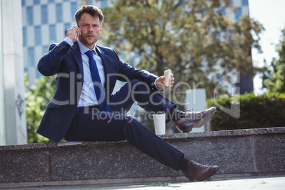 Portrait of handsome businessman talking on mobile phone