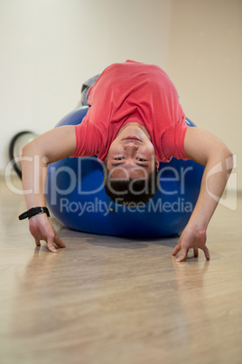 Man exercising on exercise ball