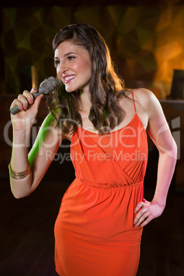 Woman singing in bar