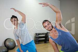 Smiling two men doing aerobic exercise