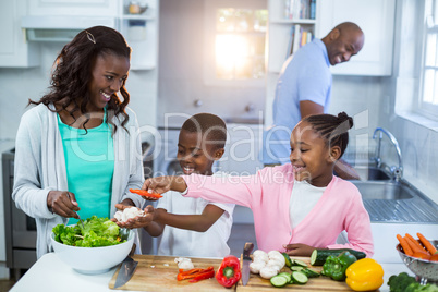 Happy family preparing food Happy family preparing food