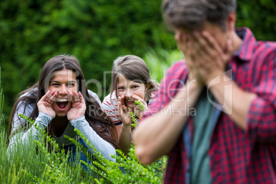 Parents and daughter playing in park