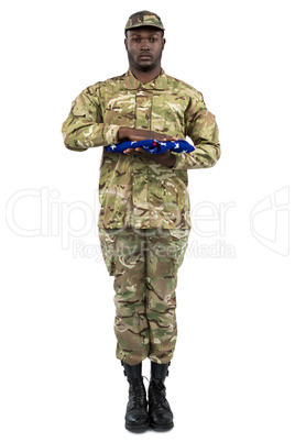 Portrait of soldier holding an american flag