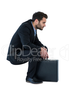 Businessman sitting on steps