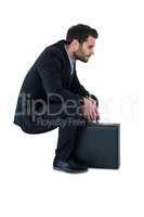 Businessman sitting on steps