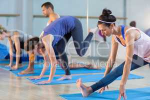 Group of people performing stretching exercise