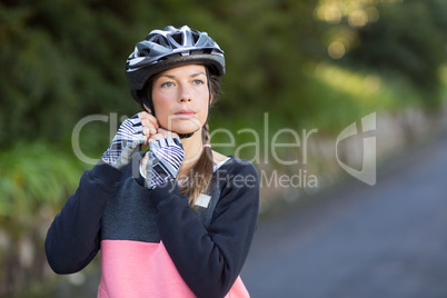 Female biker wearing bicycle helmet